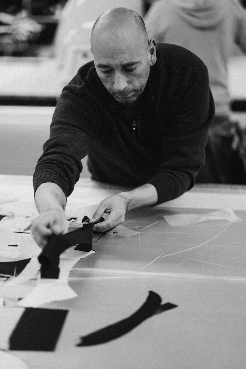Laying out cut pieces of dark cloth