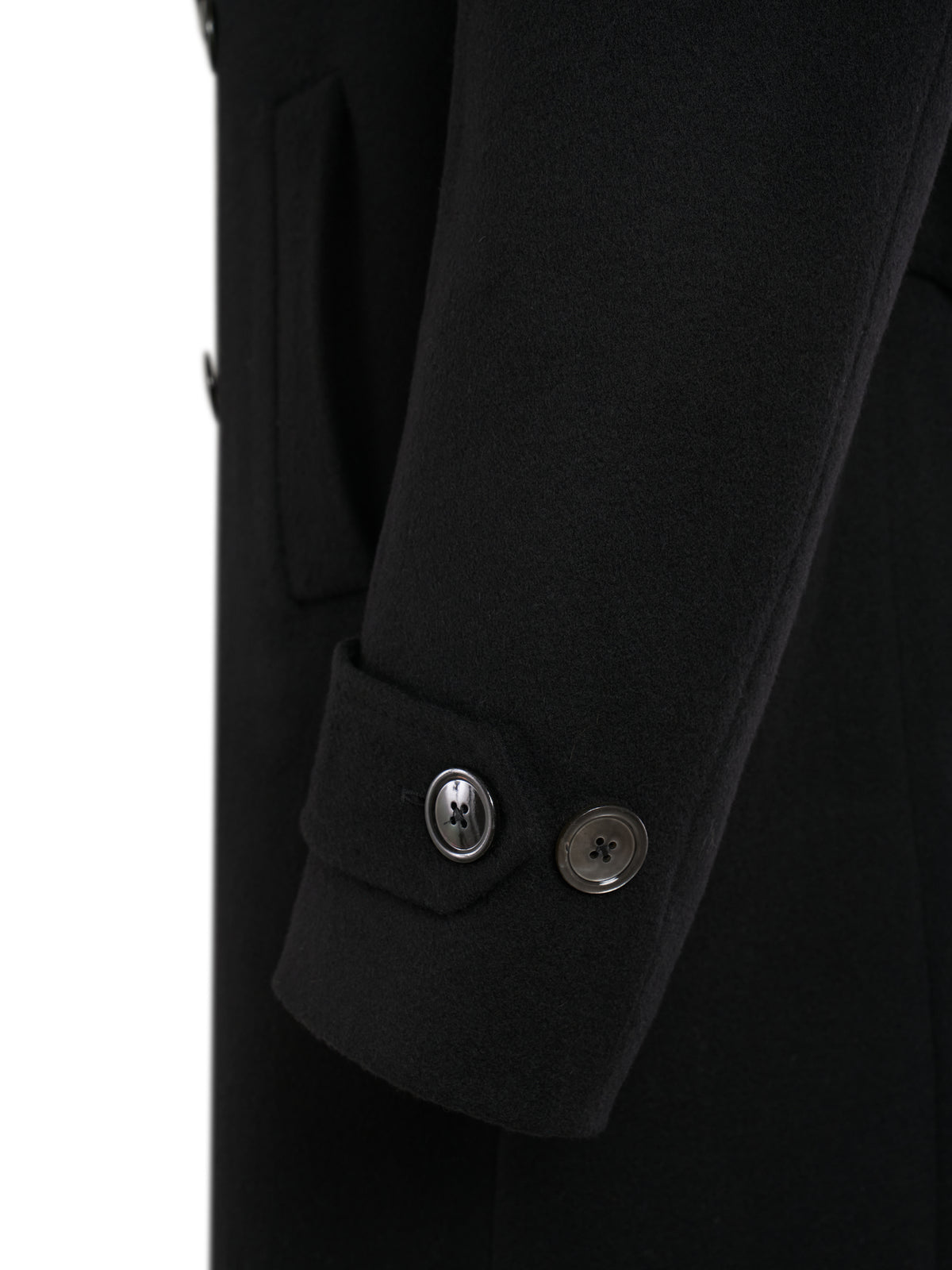 Buttoned sleeve tab of the black double-breasted overcoat
