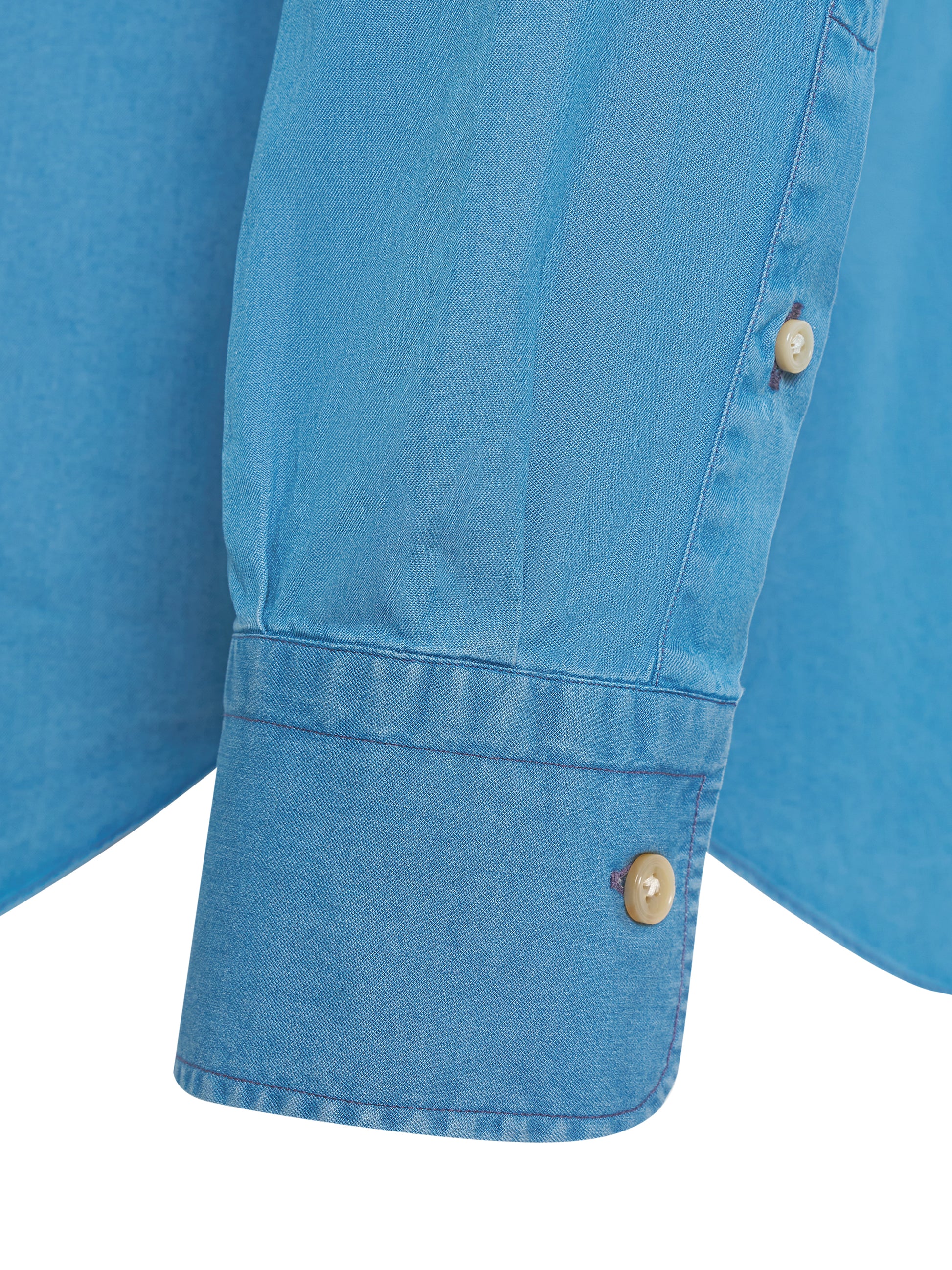Collar and button detail on ATELIER 23 denim shirt — luxury finish