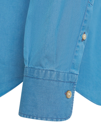 Collar and button detail on ATELIER 23 denim shirt — luxury finish