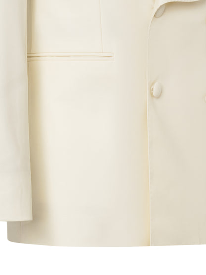 Jet pocket and covered button on the ivory tuxedo jacket