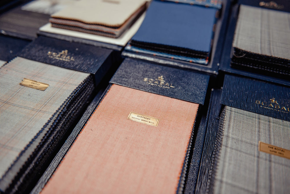 Open sample books of Italian suiting cloth