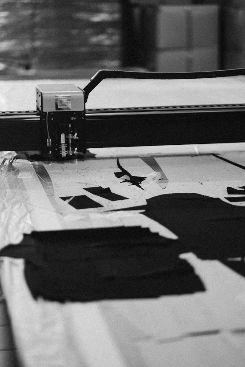 Cutting machine over dark cloth