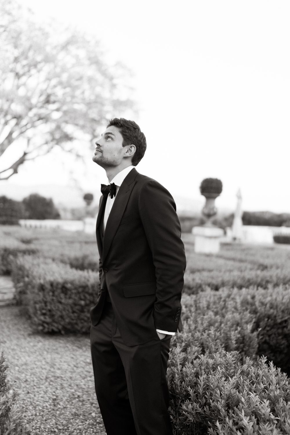 Groom in a black suit and bow tie