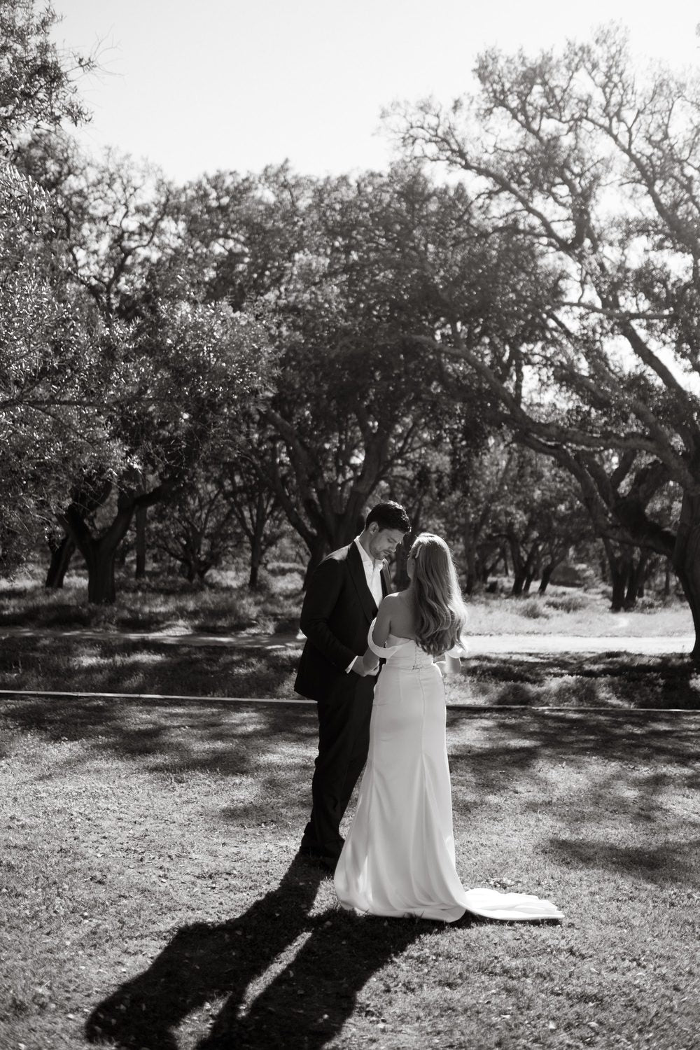 Bride and groom among the trees